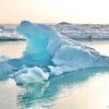 Blue iceberg in Jökulsárlón Glacier Lagoon at sunset in Iceland