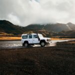 Land Rover Defender crosses an unbridged river in the Icelandic Highlands